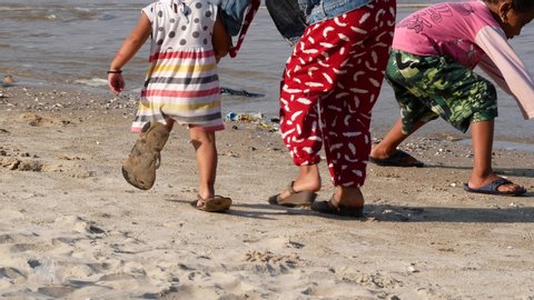 Tarakan/Indonesia-11082019: 
Children playing on the Amal beach on November, 08 2019 at Tarakan, Indonesia