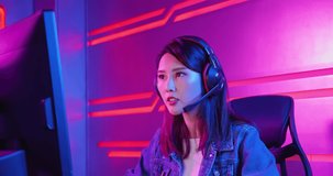 Young asian esport gamer girl feel angry while playing in Online Video Game because of keyboard is stop working