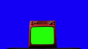 Old TV with Green Screen over a Blue Background. You can Replace Green Screen and Blue Background with the Footage or Picture you Want with “Keying” effect in After Effects.