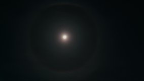 Astrophotography timelapse tracking shot of lunar halo - a circular rainbow forming around the moon - Powered by Shutterstock - Get 15% off with code: PIKWIZARD15
