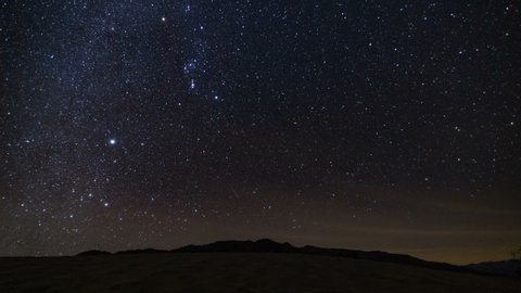 Astro Timelapse of constellation Orion over Mesquite Flat Sand Dunes in Death Valley National Park, California