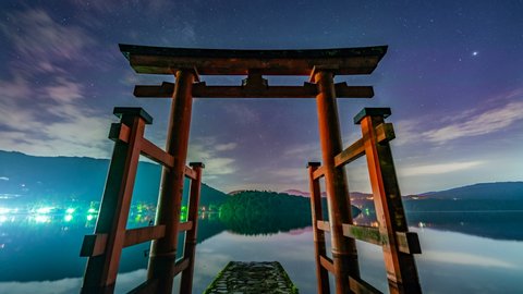 Timelapse of Milky Way galaxy over Shinto Torii Gate at Hakone Shrine by Ashinoko Lake in Japan