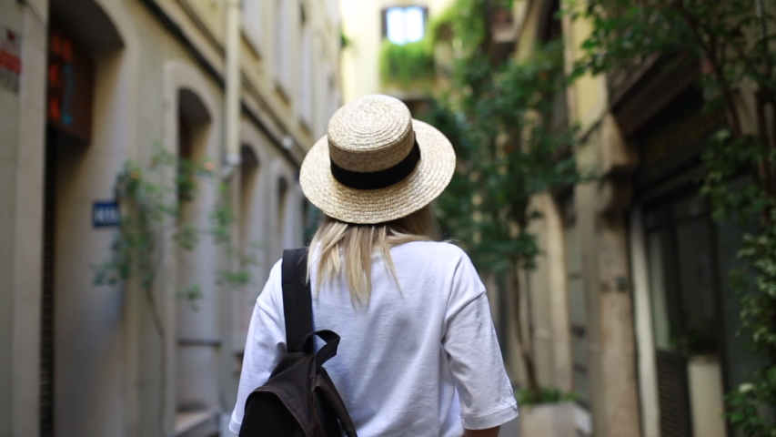 Hipster millenial girl. Spending amazing vacation time exploring new city tellig friends about impressions, walking on the srteets of beautiful city and having fun