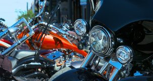 Black motorcycle spotlights, close up, Black front fender, chrome details, people in the background, day clip 4k
