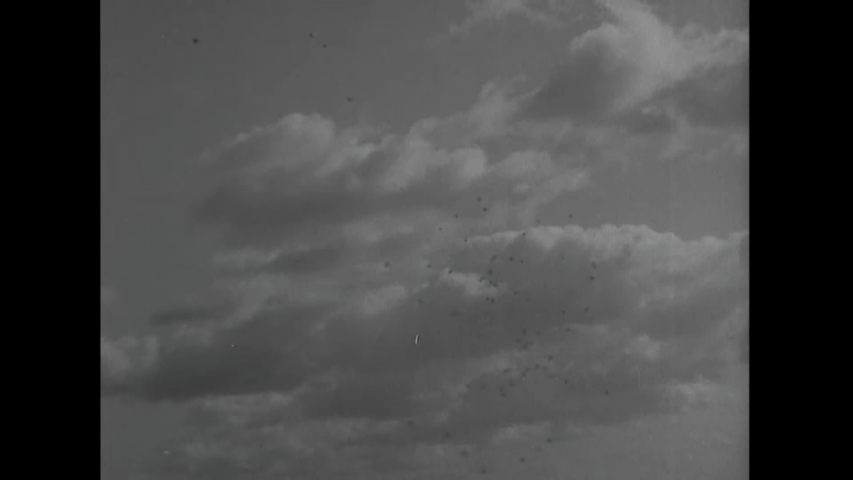 CIRCA 1945 - Ships of a US Navy task force sail under heavy flak.