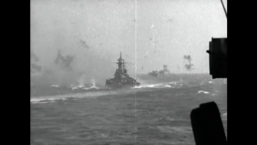 CIRCA 1940s - A US Navy convoy sails through flak-infested areas.