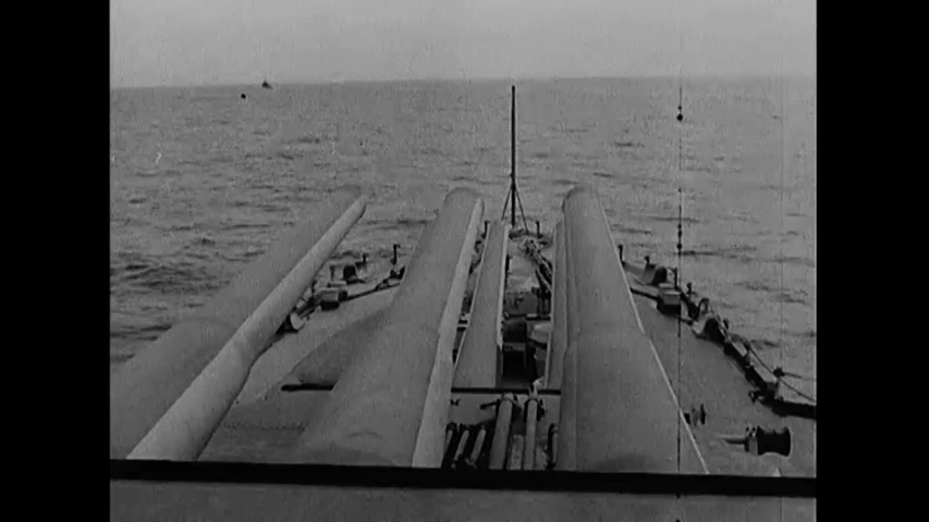 CIRCA 1940s - Navy ships fire at the coast of Kamaishi, Japan during WWII.