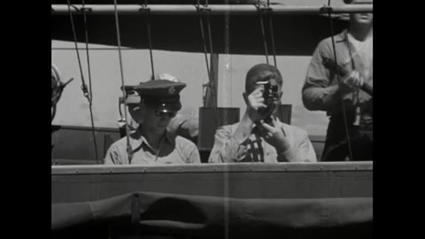 CIRCA 1944 - A US Navy officer uses a sextant at sea.