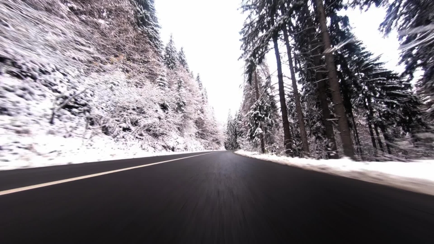 Travelling scenic winter road by car