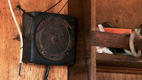 Old Rusty Radio Speaker in the Wheelhouse of a Traditional Fishing Boat in the Port of Mar del Plata, Argentina. Close-Up. 