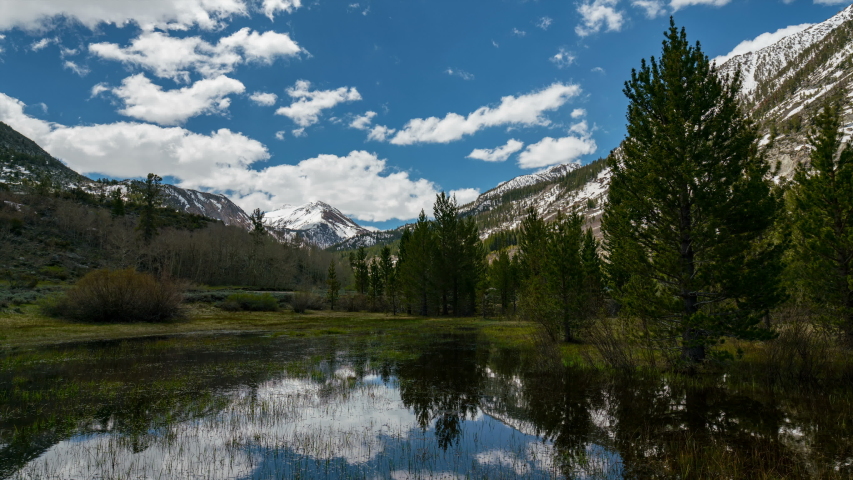 Timelapse of reflective alpine lake in Sierra Nevada Mountains, California
