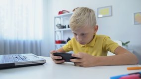Addicted boy playing cellphone game instead of doing homework, mom scolding son