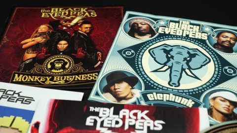 Rome, Italy - November 02, 2019: CD and artwork of CD and artwork of alternative American hip hop band The Black Eyed Peas. 