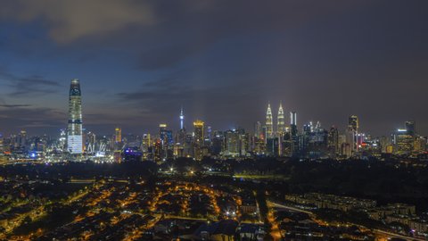 Time lapse: Kuala Lumpur city view during dawn overlooking the city skyline in Federal Territory, Malaysia. Zoom out motion timelapse. Prores 4K