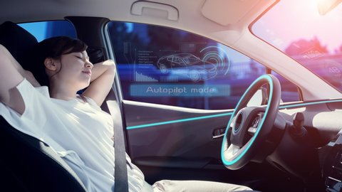 sleeping woman in autonomous car. self driving vehicle. autopilot. automotive technology.