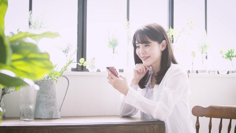 A beautiful woman is using a smartphone