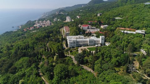 aerial view of Livadiysky Palace, Yalta. South coast of Crimea. lush green forest, garden. black sea, above, top, castle, tourism architecture