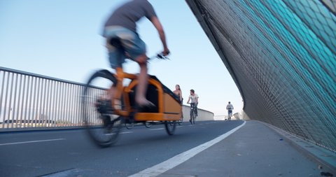 Copenhagen / Denmark - 4 August 2019: Bicycle riders on bicycle bridge in Copenhagen City on a beautiful summer day