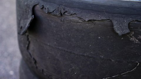 Destroyed car auto tire after drift race
