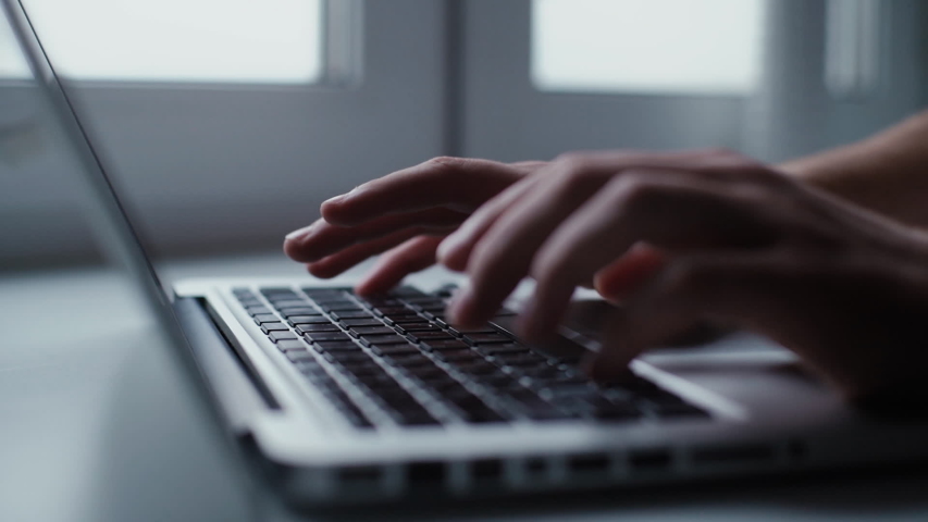 Man opening laptop and starts typing on keyboard of computer, close-up. Side view. Shooting in slow motion Royalty-Free Stock Footage #1040723105