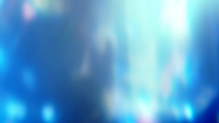 Glowing blue background. Lights flare. Multicolor defocused flecks motion effect. - Powered by Shutterstock - Get 15% off with code: PIKWIZARD15