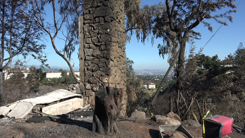 LOS ANGELES, CA/USA - NOVEMBER 7, 2019: A chimney and a red “unsafe” tag left by the Los Angeles Fire Department is all that remains of a home after the Getty Fire
