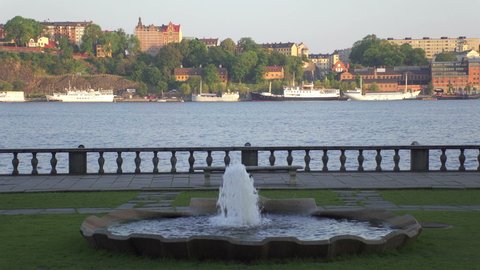 STOCKHOLM, SWEDEN - CIRCA 2019: Fountain in Stockholm City Hall park located on the waterfront of Lake Malaren