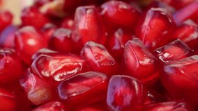 macro rotate video of Seeds of a pomegranate that is red like a ruby ​​that can be eaten