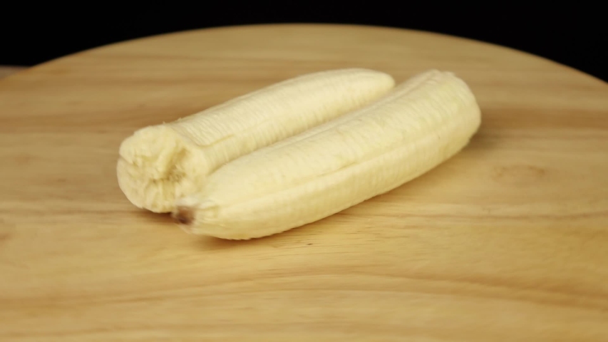 banana without peel broken in half rotates 360 degrees