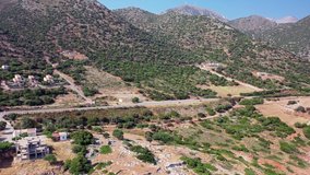 Aerial view from drone on highway road  near Kalo Horafi or Vossako beach on Crete, Greece, Rethymno prefecture.