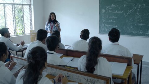 Dehradun,Uttarakhand/India- August 1 2019:  Professor Reads Lecture to college Students, Bright Indian Students .Smart Young Future Generation in Indian Classroom. Education for girls in India.