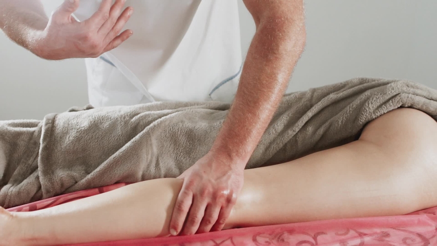 Massage concept. Beautiful young woman reciving relxing massage