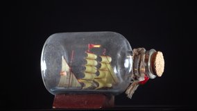 Bottle ship background.Pan Rotating Video Clip Footage of a ship in bottle
