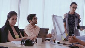Senior leader giving advice speech to team members. Creative business people meeting at table in modern office. Multicultural business team. - Powered by Shutterstock - Get 15% off with code: PIKWIZARD15