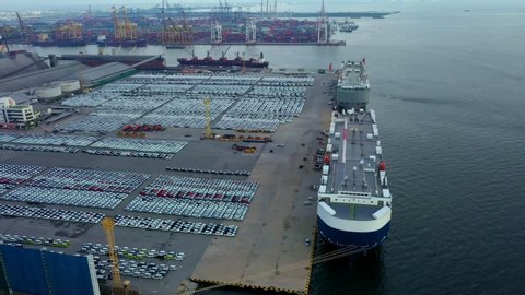 Aerial view ro-ro ship, Transportation of business logistic sea freight, New Cars produced by year up in the port for Cargo ship and Cargo import-export around in the world