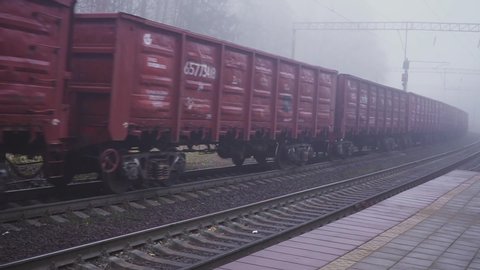 Container loaded on train wagons on a railway