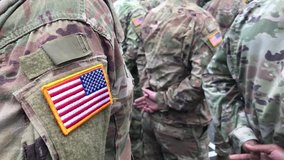 US soldiers. US army. USA patch flag on the US military uniform. Soldiers on the parade ground from the back. Veterans Day. Memorial Day. - Powered by Shutterstock - Get 15% off with code: PIKWIZARD15