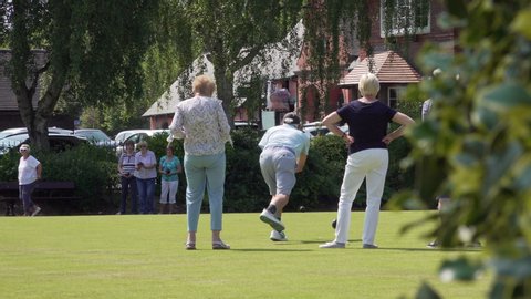 PORT SUNLIGHT, MERSEYSIDE/ENGLAND - JULY 16, 2019: Unidentified people play crown green bowls in Port Sunlight, Wirral, England