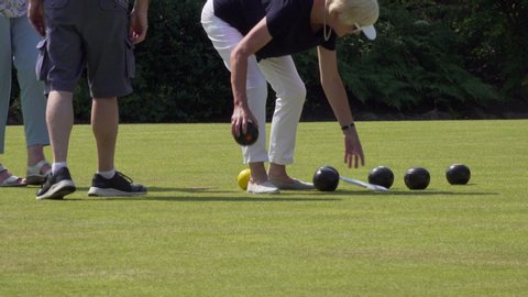 PORT SUNLIGHT, MERSEYSIDE/ENGLAND - JULY 16, 2019: Unidentified people play crown green bowls in Port Sunlight, Wirral, England