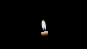 No Sound Footage, center side, Established White Flamming Candle at Black Background, For Christmas Related moment
