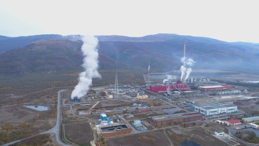 Pollution smoke coming out from smokestack of copper smelter refinery
