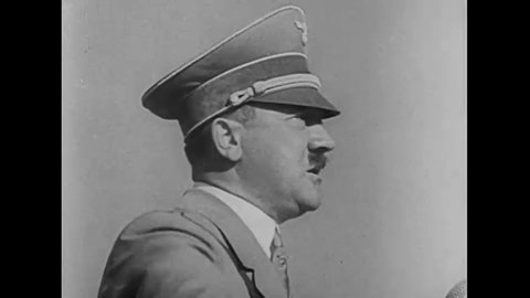 CIRCA 1943 - Hitler makes a speech at Nuremberg Stadium. Japanese sailors visit an exhibit on Germany's military power.