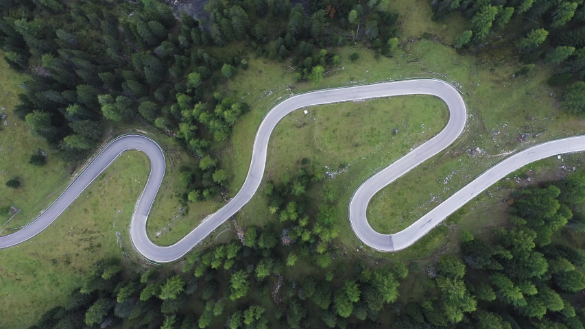 Aerial top down view , white car driving on the mountains road in the forest.Camera move up | Shutterstock HD Video #1040851322