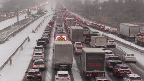 Toronto, Ontario, Canada November 11 2019 Massive traffic jam of cars stuck during snow storm on highway 