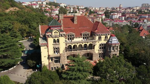 QINGDAO, CHINA – SEPTEMBER 2019: China heritage and history - drone flight museum of the former German Governor's Residence building in Qingdao