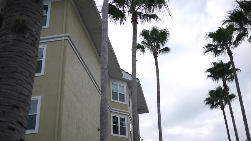An establishing shot of an apartment or hotel resort on overcast day