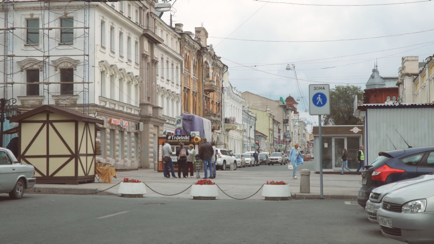 Samara, Russia - October 11, 2019: A group of people stand at the intersection of the pedestrian zone and talk