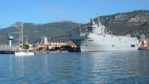 TOULON, FRANCE - SEPTEMBER 24, 2019: Amphibious assault ship Mistral in the port of Toulon. Commissioned in 2006, it is the lead ship of the Mistral-class amphibious assault ships