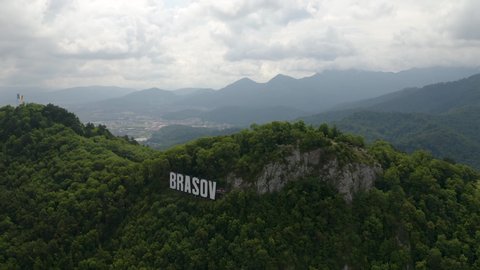 4K Brasov / Romania, Romania Flag, Brasov Hollywood Style Mountain Sign Drone
