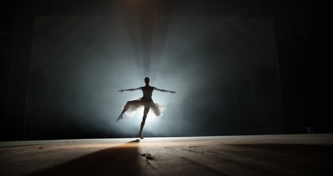 Creative female choreographer setting a ballet performance, dancing and doing various moves on spotted stage - arts concept 4k footage